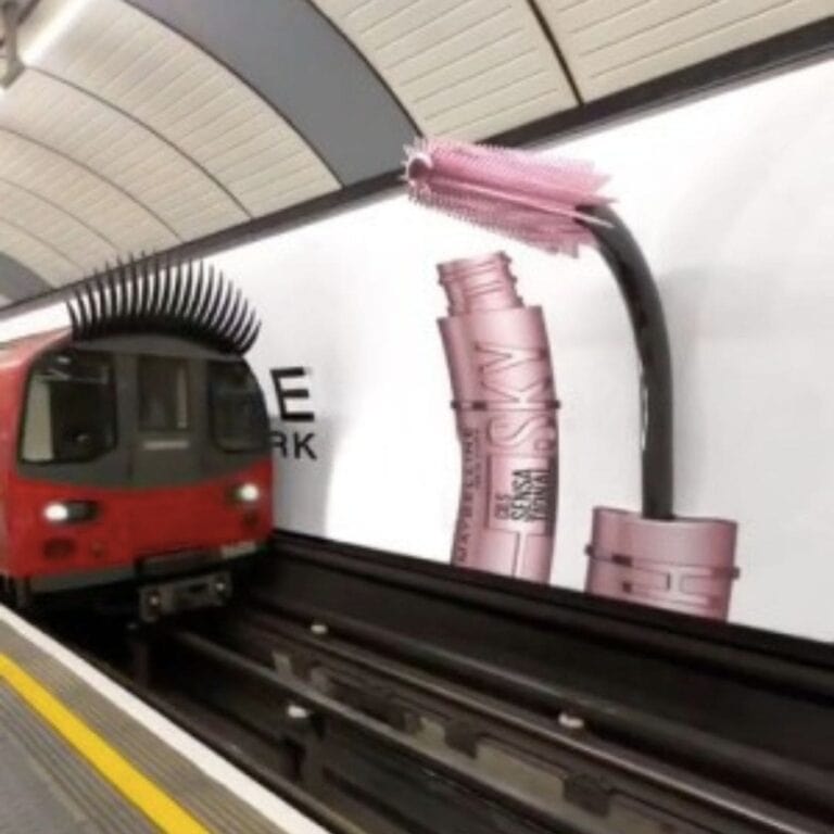 A still from a TikTok video showing a subway with eyelashes interacting with a mascara pink brush as it pulls into the station.